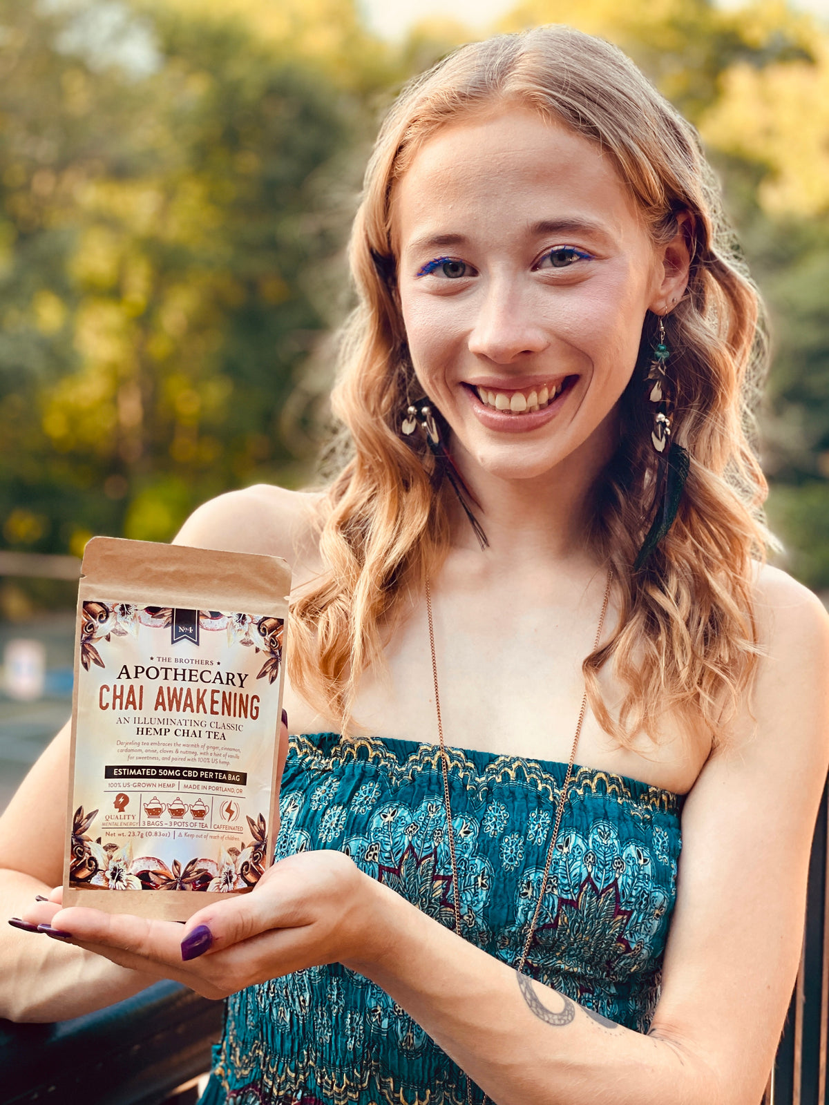 Image of a beautiful caucasian woman modeling CBD tea.